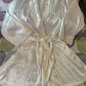 Polyester lifter, cream color embroidered collar and sleeves.